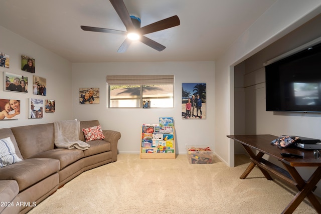 carpeted living room featuring ceiling fan