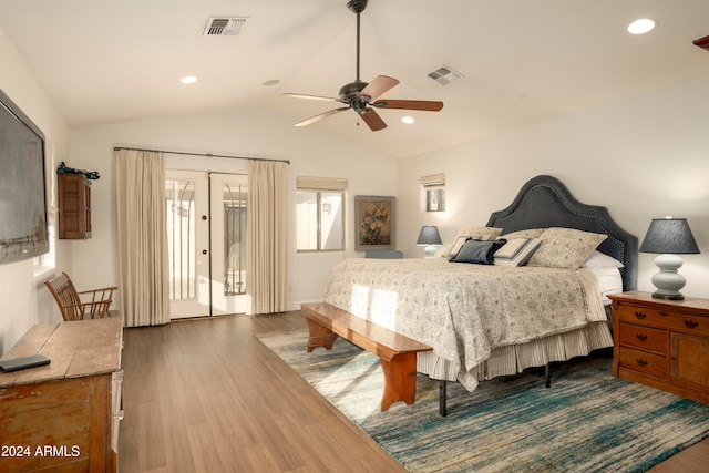 bedroom featuring dark hardwood / wood-style floors, ceiling fan, access to exterior, and vaulted ceiling