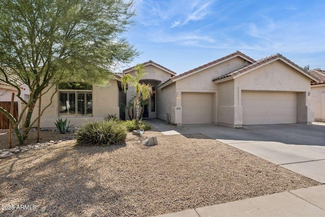 14452 N 98th Pl, Scottsdale, AZ 85260 - ranch-style home with a garage, driveway, stucco siding, and a tile roof