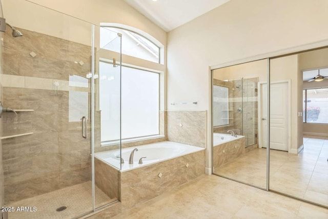 14452 N 98th Pl, Scottsdale, AZ 85260 - bathroom featuring a stall shower, a bath, and tile patterned floors