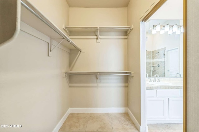 14452 N 98th Pl, Scottsdale, AZ 85260 - spacious closet featuring a sink and light tile patterned floors
