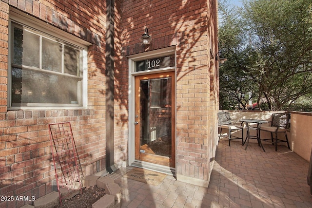 doorway to property featuring a patio area