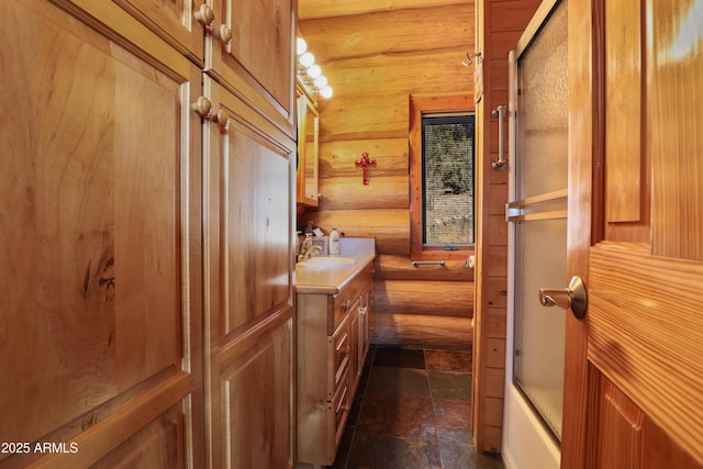 bathroom featuring vanity and enclosed tub / shower combo