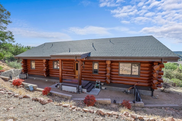 back of property with a patio