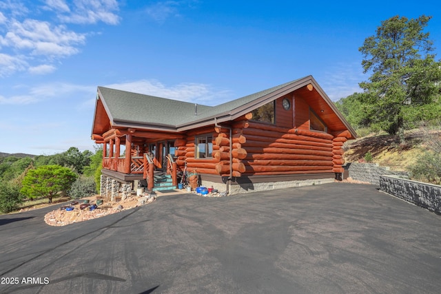 log cabin with covered porch