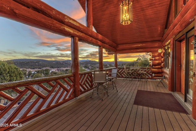 deck at dusk with a mountain view