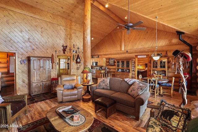 living room with wood ceiling, wood-type flooring, beam ceiling, and high vaulted ceiling