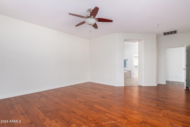 spare room featuring hardwood / wood-style flooring and ceiling fan