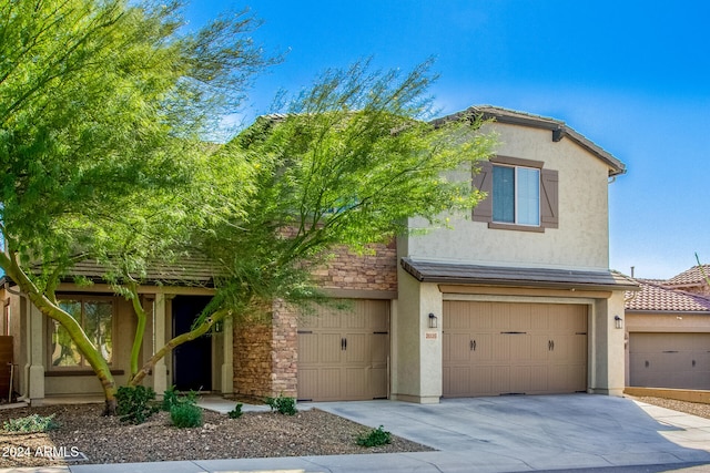 view of front of home with a garage