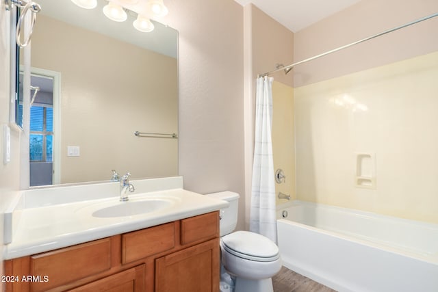 full bathroom featuring vanity, shower / bath combination with curtain, toilet, and wood-type flooring