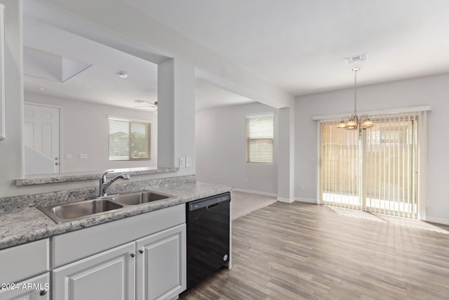 kitchen featuring sink, light wood-type flooring, black dishwasher, and a healthy amount of sunlight