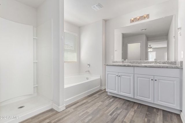 bathroom featuring ceiling fan, vanity, shower with separate bathtub, and wood-type flooring