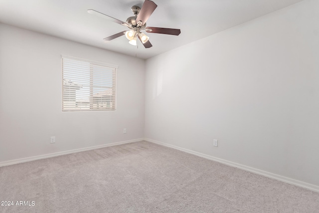 empty room featuring ceiling fan and carpet flooring