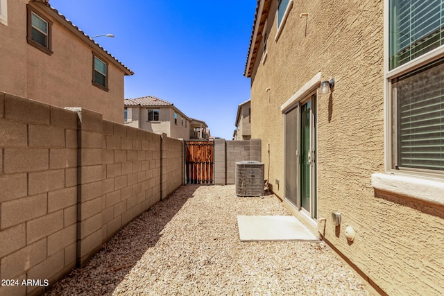 view of yard featuring central AC and a fenced backyard