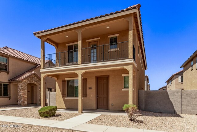 view of front of home with a balcony