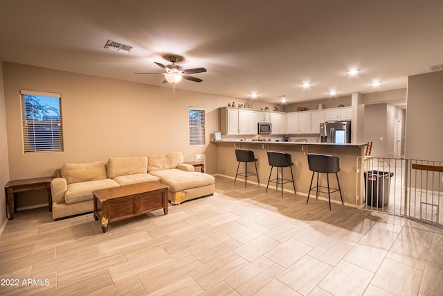 living room with ceiling fan