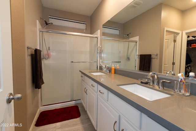 bathroom with vanity and walk in shower