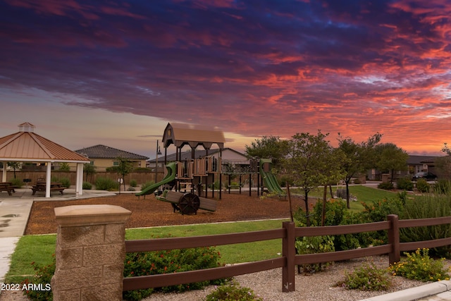 playground at dusk with a gazebo