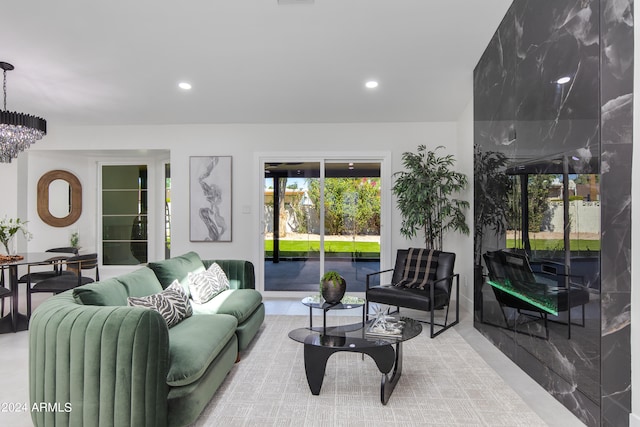 living room with a chandelier and a healthy amount of sunlight