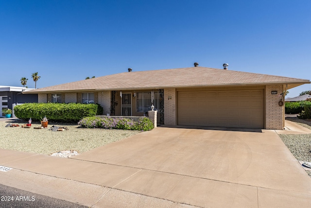 ranch-style house featuring a garage