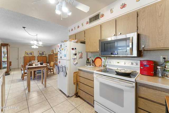 kitchen with white appliances, light tile flooring, ceiling fan, and a textured ceiling