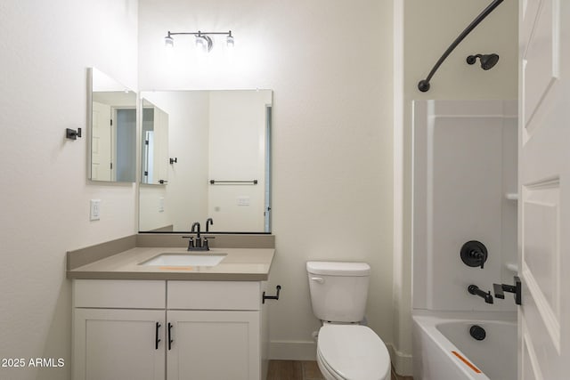 full bathroom with vanity, toilet, and washtub / shower combination