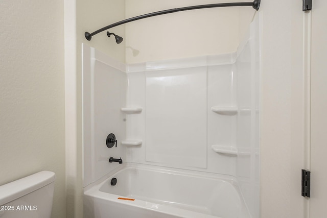 bathroom featuring toilet and tub / shower combination