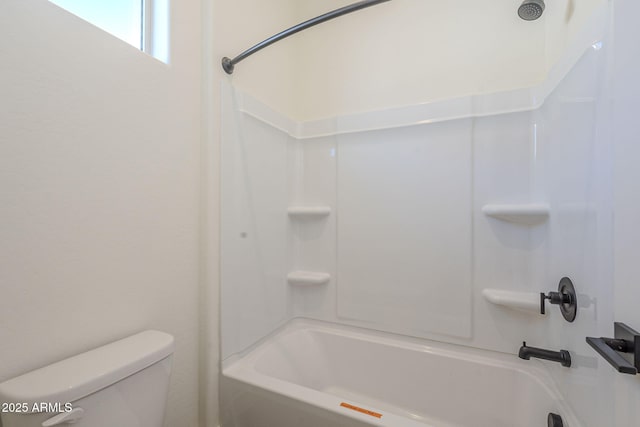 bathroom featuring toilet and shower / bath combination