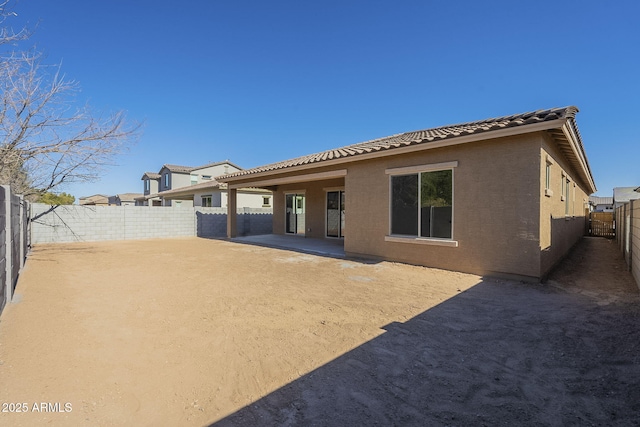 back of property featuring a patio