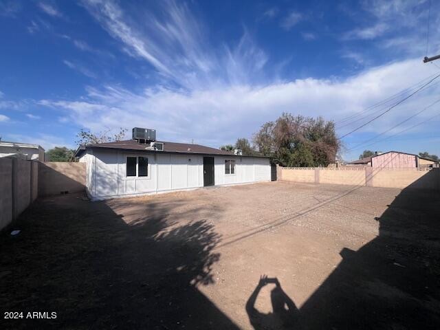 back of property with central air condition unit