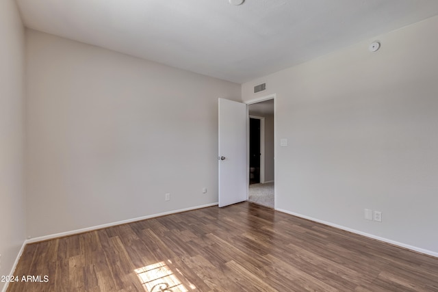 empty room featuring hardwood / wood-style flooring