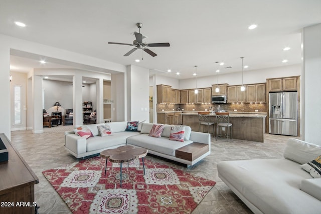 living room with ceiling fan