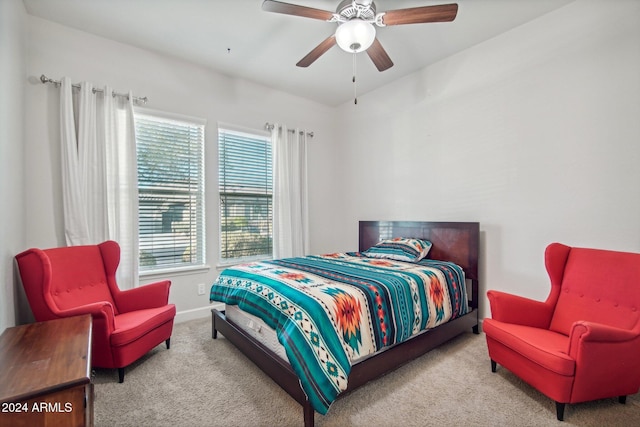 bedroom featuring ceiling fan and light colored carpet