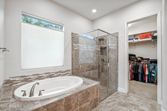 bathroom with shower with separate bathtub