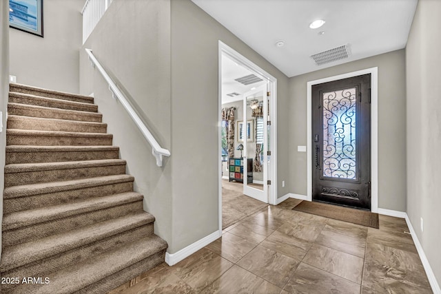 12932 W Cassia Trl, Peoria, AZ 85383 - entrance foyer with stairway and marble look tiles