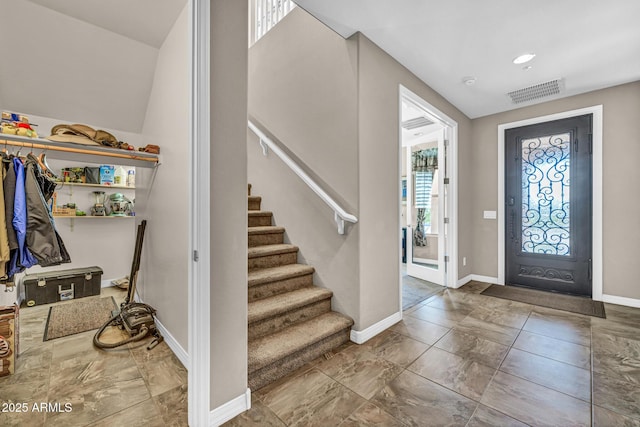12932 W Cassia Trl, Peoria, AZ 85383 - foyer featuring stairway and marble look tile flooring