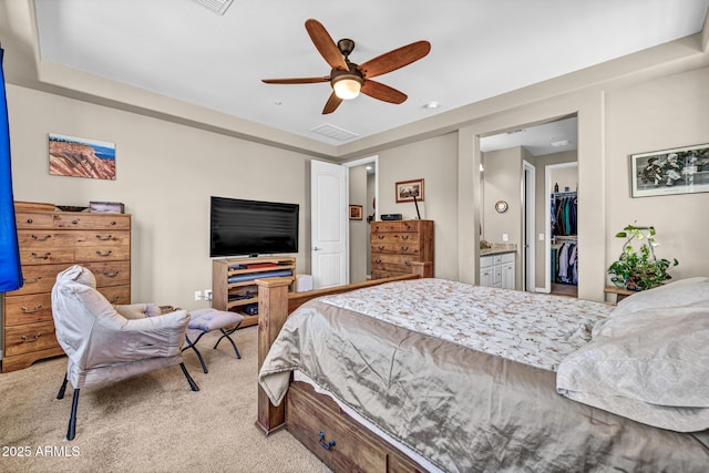 12932 W Cassia Trl, Peoria, AZ 85383 - carpeted bedroom with a spacious closet, a closet, ceiling fan, and ensuite bathroom