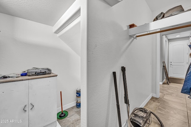 12932 W Cassia Trl, Peoria, AZ 85383 - interior space with baseboards and a textured ceiling