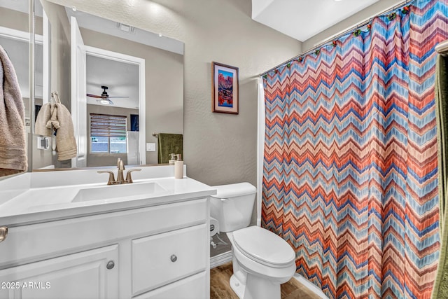 12932 W Cassia Trl, Peoria, AZ 85383 - full bathroom featuring a textured wall, a ceiling fan, vanity, and a shower with shower curtain
