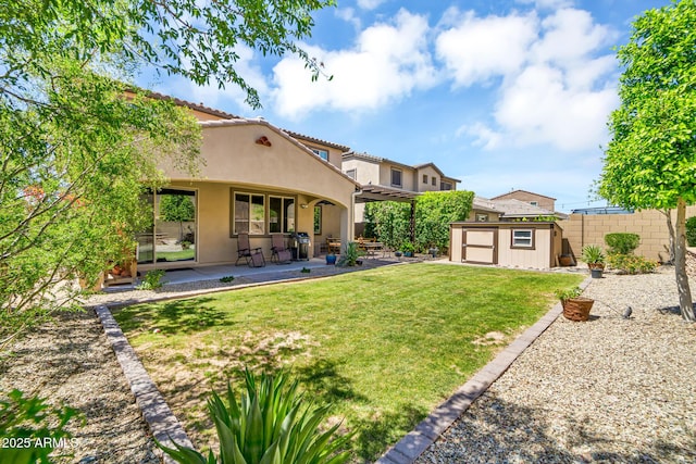 12932 W Cassia Trl, Peoria, AZ 85383 - back of property featuring a shed, stucco siding, and a patio