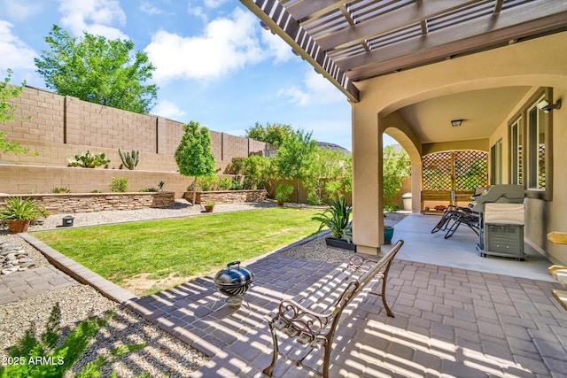 12932 W Cassia Trl, Peoria, AZ 85383 - fenced backyard featuring a patio area and grilling area