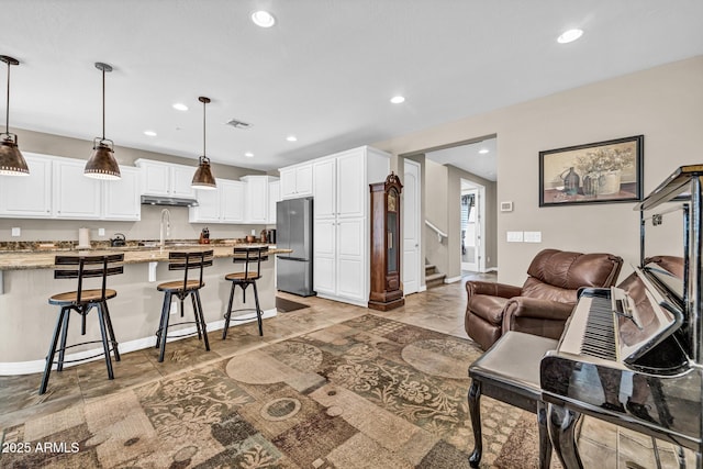 12932 W Cassia Trl, Peoria, AZ 85383 - living room with recessed lighting and stairway
