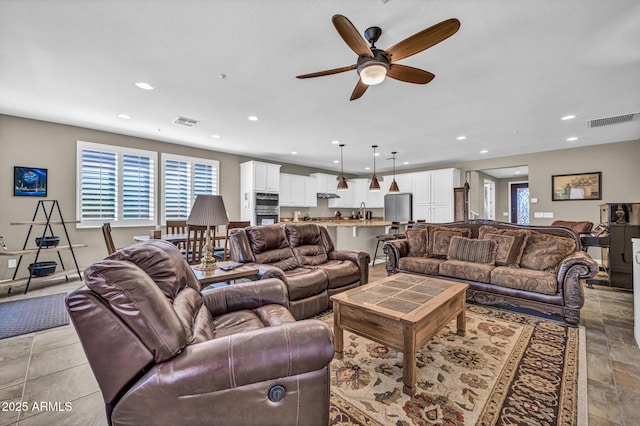 12932 W Cassia Trl, Peoria, AZ 85383 - living area featuring healthy amount of natural light, recessed lighting, and ceiling fan