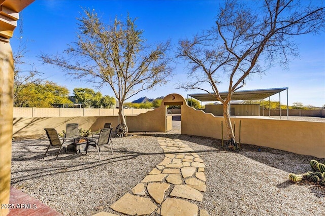 view of patio featuring an outdoor fire pit