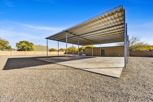 view of parking / parking lot with a carport