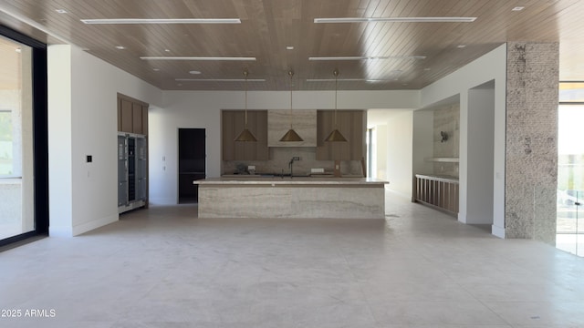 4644 E Indian Bend Rd, Paradise Valley, AZ 85253 - kitchen featuring modern cabinets, a spacious island, wooden ceiling, light countertops, and a sink