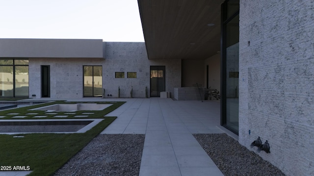 4644 E Indian Bend Rd, Paradise Valley, AZ 85253 - view of exterior entry featuring a patio area