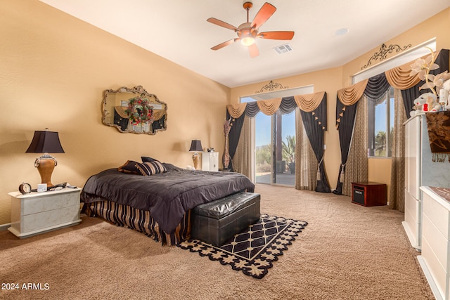 carpeted bedroom with ceiling fan and access to exterior