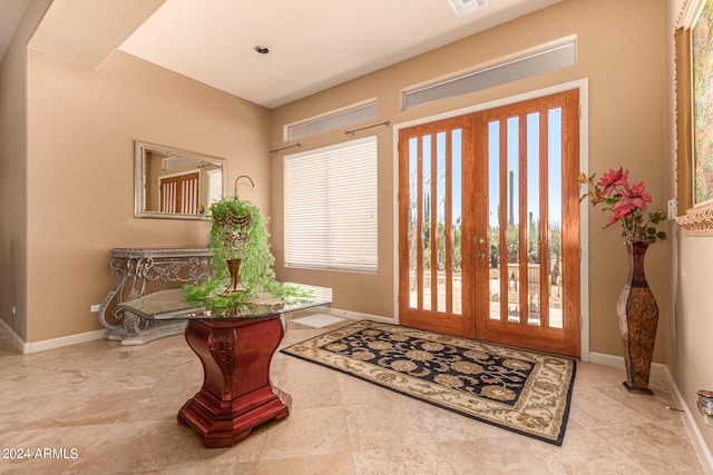 tiled foyer with plenty of natural light