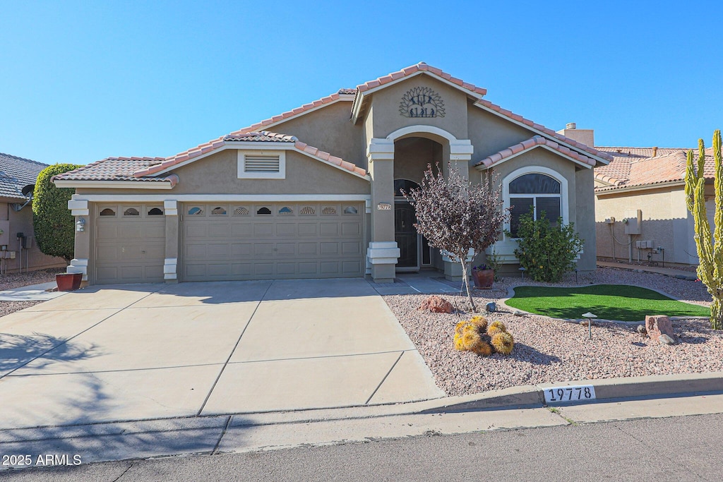 view of front of property with a garage